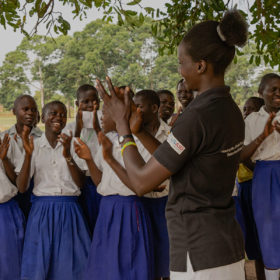Gloria, one of the trainers talks to a DREAMS group