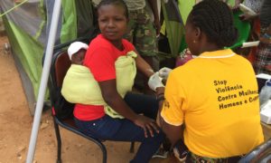 Woman and her child getting HIV screening