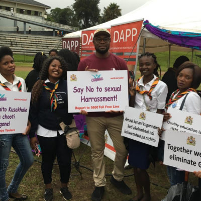 Mbonisi Tshuma, WEI/Bantwana Malawi Team Lead, poses with campaign participants at the launch of the 16 Days of Activism in Malawi.